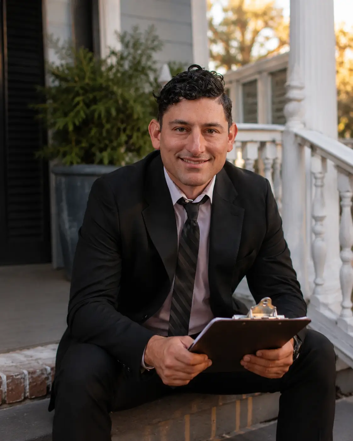 Savannah REALTOR Alex Rodino seated outside a home, ready to help decide whether to sell in 2026