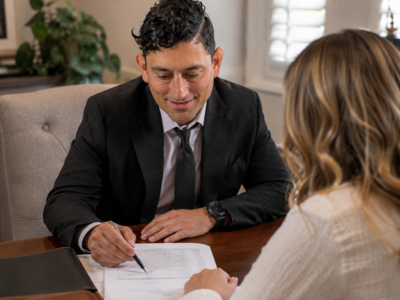 Savannah REALTOR Alex Rodino reviewing home-selling costs with a seller during a listing consultation