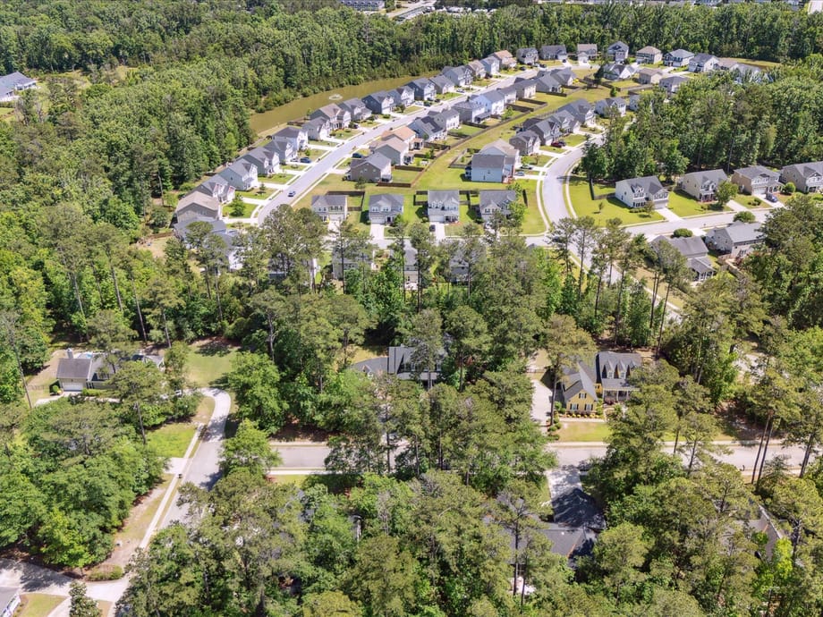 Aerial view of a master-planned Richmond Hill, GA neighborhood surrounded by trees